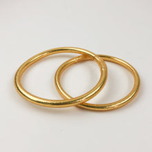 Load image into Gallery viewer, Vinyl bracelet filled with 24 karat gold leaf, sealed with a prayer of protection and sacred oils. Often worn in even numbers, in sets of 3, 5, 7, or 9, for a beautiful statement and to bring good luck.  Kumali jewelry is light, flexible, comfortable, waterproof, and resistant to time. The perfect summer-proof (and shower-proof!) staple.  Internal diameter size:   Small - 5.5 centimeters  Medium - 6.5 centimeters  Large -  7.5 centimeters