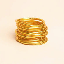 Load image into Gallery viewer, Vinyl bracelet filled with 24 karat gold leaf, sealed with a prayer of protection and sacred oils. Often worn in even numbers, in sets of 3, 5, 7, or 9, for a beautiful statement and to bring good luck.  Kumali jewelry is light, flexible, comfortable, waterproof, and resistant to time. The perfect summer-proof (and shower-proof!) staple.  Internal diameter size:   Small - 5.5 centimeters  Medium - 6.5 centimeters  Large -  7.5 centimeters