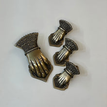 Load image into Gallery viewer, Let our Brass Hand Clip lend a hand in keeping all your important papers around your home or office together.  It features a hole in the top center so you can hang on a wall as well.   Small: 4&quot; L 2&quot; W 1&quot; H  Large: 5.25&quot; L 2.50&quot; W 1.25&quot; H
