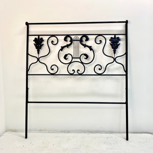 Realize your Riviera decor dreams with this beautiful French daybed frame. Includes a footboard identical to the headboard and side rails with matching adornments.   Pick up or local delivery only. Come by the shop to see this one-of-a-kind piece in person!   Dimensions: H 29" x W 75" x D 44". Interior will accommodate a twin-sized mattress. Iron
