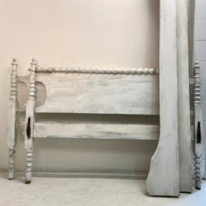 This antique custom-build bedframe evokes the peace and simplicity of country-style decor. Includes a footboard identical to the headboard and matching wooden side rails.   Pick up or local delivery only. Come by the shop to see this one-of-a-kind piece in person!   Dimensions: H 37.5" x W 71.5" x D 50.5". Interior will accommodate a 3/4 sized mattress (between a full and a queen) Wood