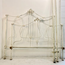 Load image into Gallery viewer, With sweet floral details and a thin but sturdy metal build, this vintage bedframe is both playful and sophisticated. Includes a headboard, footboard, and side rails.  Pick up or local delivery only. Come by the shop to see this one-of-a-kind piece in person!   Dimensions: Headboard: H 54&quot; x W 78.5&quot; x D 53&quot;. Footboard:  H 45&quot; x W 78.5&quot; x D 53&quot;. Interior will accommodate a full-sized mattress Iron     

