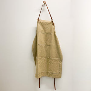 This durable canvas apron features brown leather straps and multiple pockets. With plenty of room for recipe cards, a phone, and a small towel, never be too far away from the items you need most. Perfect for cooking, crafts, or projects around the home.