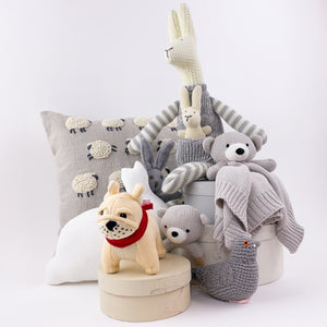 This beautiful pillow with embroidered and applique sheep is perfect for a nursery or child's bedroom. Evocative of Princess Diana's iconic sheep sweater from Rowing Blazers, it could also add a touch of whimsy to any living room.  Material: 100% cotton. Sold with insert. Dry clean only.  Dimensions: 12"x16"