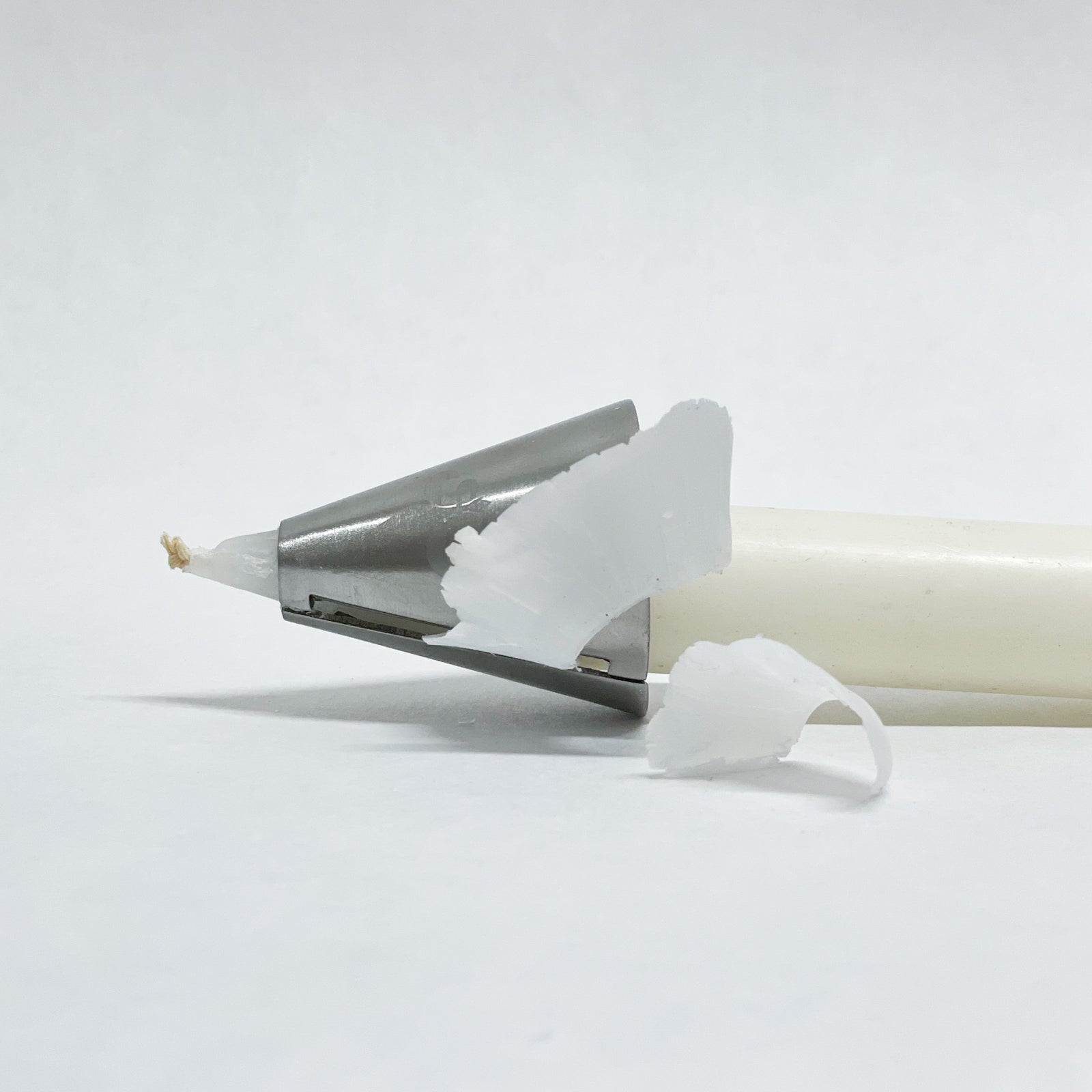 A wonderful tapered candle shaver with a fleur de lis decoration. A taper candle shaver is used to ensure your candles fit perfect to your candle holders. 