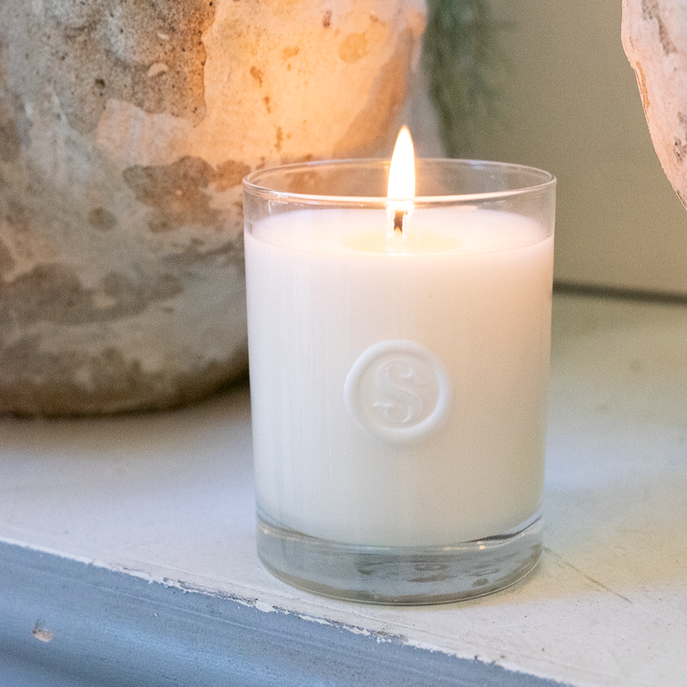 Our beloved Signature Scented Candle is made locally from all natural soy coconut wax with no synthetic oils added.   Details: 13.5 oz tumbler featuring our logo wax seal detail