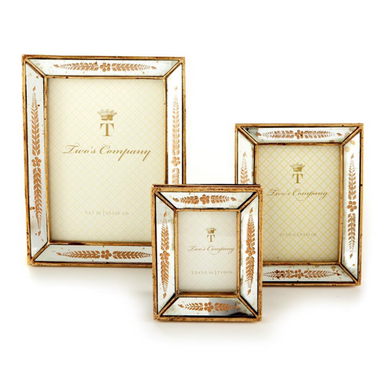 These gold leaf mirror frames are created with a timeless design that will never cease to surround your memories with beauty and elegance. These mirrors are backed with an easel prop stand for a beautiful table top display.   Dimensions:  Small: 4