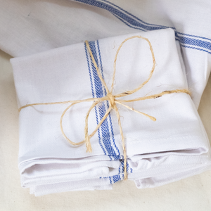French bistro towels sold in sets of four or individually. A great addition to any kitchen.  You can order these in a bundle of four or in singles.  Size: 24.5" H 14" W  100% Cotton  *These can be bleached and the blue stripe will not bleed. 