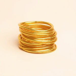 Vinyl bracelet filled with 24 karat gold leaf, sealed with a prayer of protection and sacred oils. Often worn in even numbers, in sets of 3, 5, 7, or 9, for a beautiful statement and to bring good luck.  Kumali jewelry is light, flexible, comfortable, waterproof, and resistant to time. The perfect summer-proof (and shower-proof!) staple.  Internal diameter size:   Small - 5.5 centimeters  Medium - 6.5 centimeters  Large -  7.5 centimeters