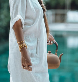 Vinyl bracelet filled with 24 karat gold leaf, sealed with a prayer of protection and sacred oils. Often worn in even numbers, in sets of 3, 5, 7, or 9, for a beautiful statement and to bring good luck.  Kumali jewelry is light, flexible, comfortable, waterproof, and resistant to time. The perfect summer-proof (and shower-proof!) staple.  Internal diameter size:   Small - 5.5 centimeters  Medium - 6.5 centimeters  Large -  7.5 centimeters