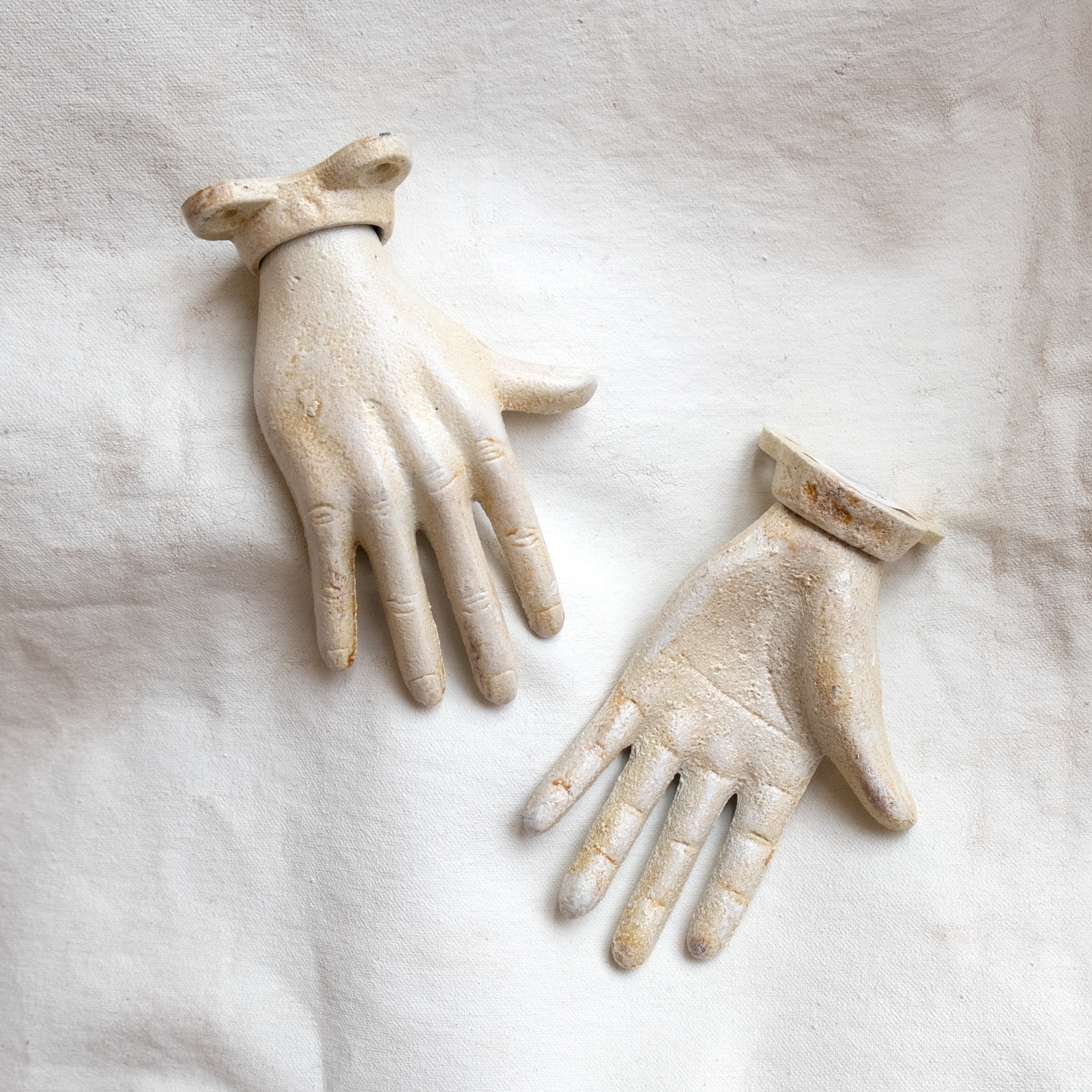 Petite in scale but true to life in shape our cast iron hands are sold separately by the left and the right. With a simple 2-screw wall mount the hands may be hung securely in countless positions.     Dimensions:  Length: 3.25 inch.   Height: 5.50 inch.